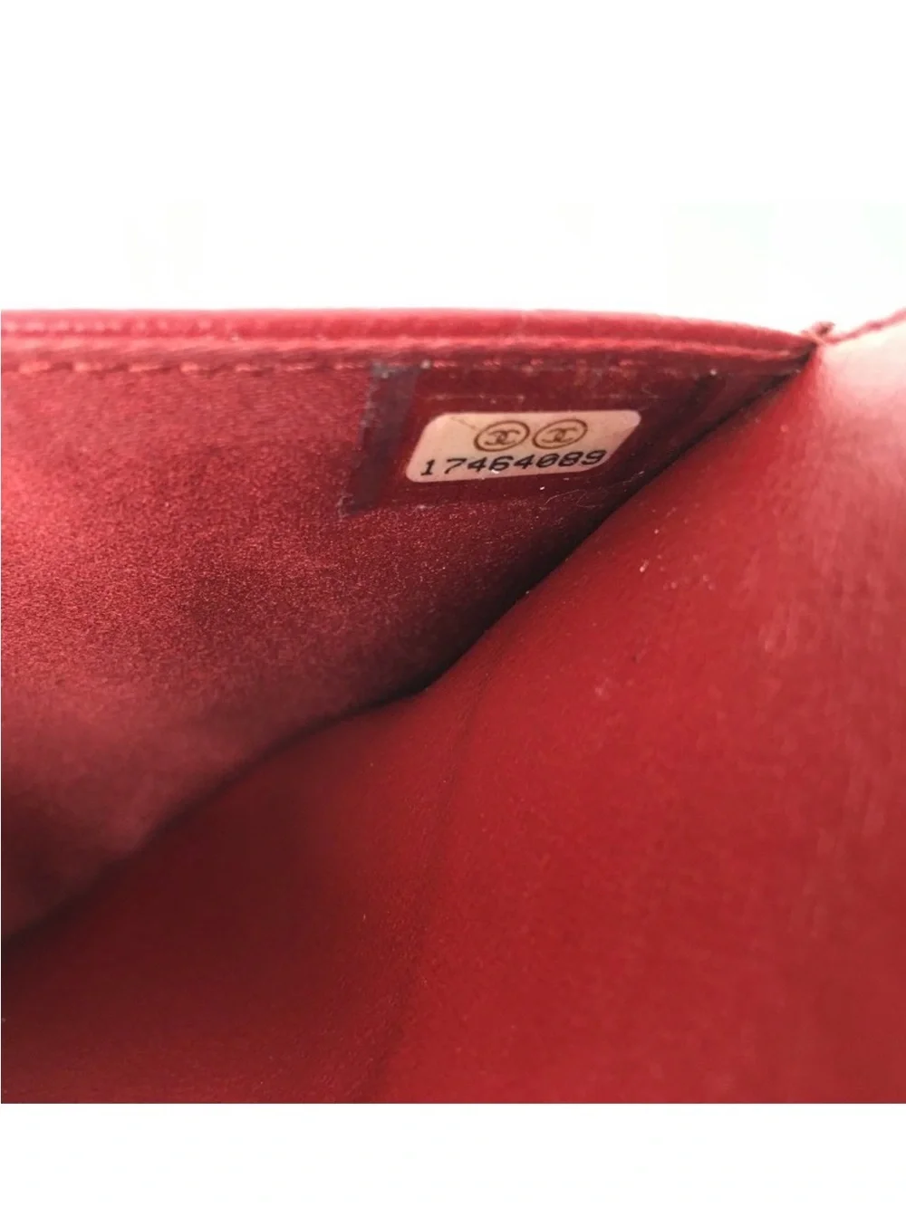 CHANEL Camellia-Embossed Leather Clutch in Deep Red with Silver CC